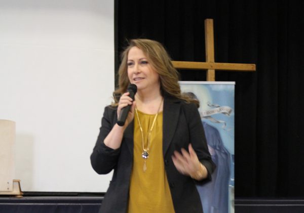 Angèle Regnier addresses students at St. Francis Xavier CHS