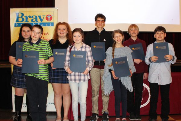 Student recipients of the Bravo Breakfast Award standing with their certificates. 