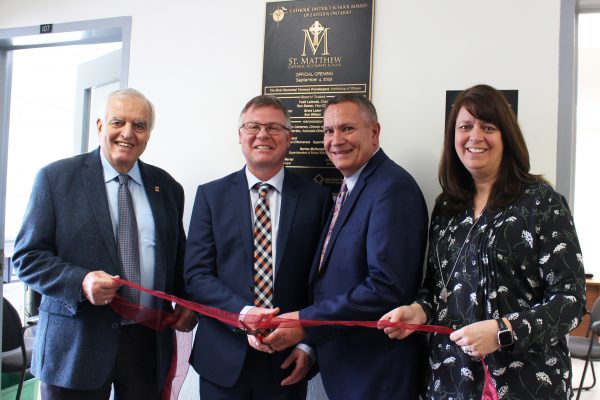 Cutting ribbon group portrait shot