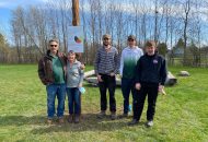 Staff and students pose at the outdoor Indigenous classroom at St. John Catholic High School in Perth.