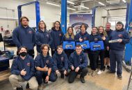 Students posing with prizes from competition.