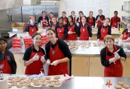 Students pose with smile cookies.