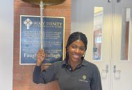 Student Estelle Ngwa ringing the bell at Holy Trinity Catholic Secondary School.