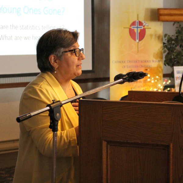 Keynote speaker Dr. Bernardine Ketelaars speaking at a podium.