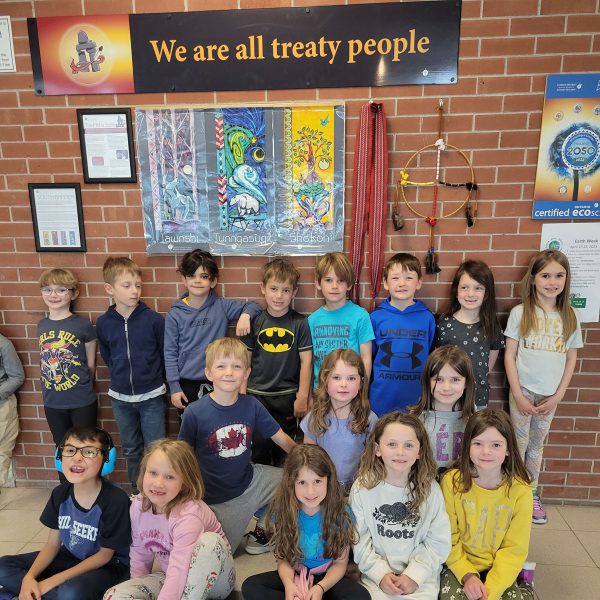 Students at St. Joseph Catholic School, Gananoque with their new “We are all treaty people” banner.