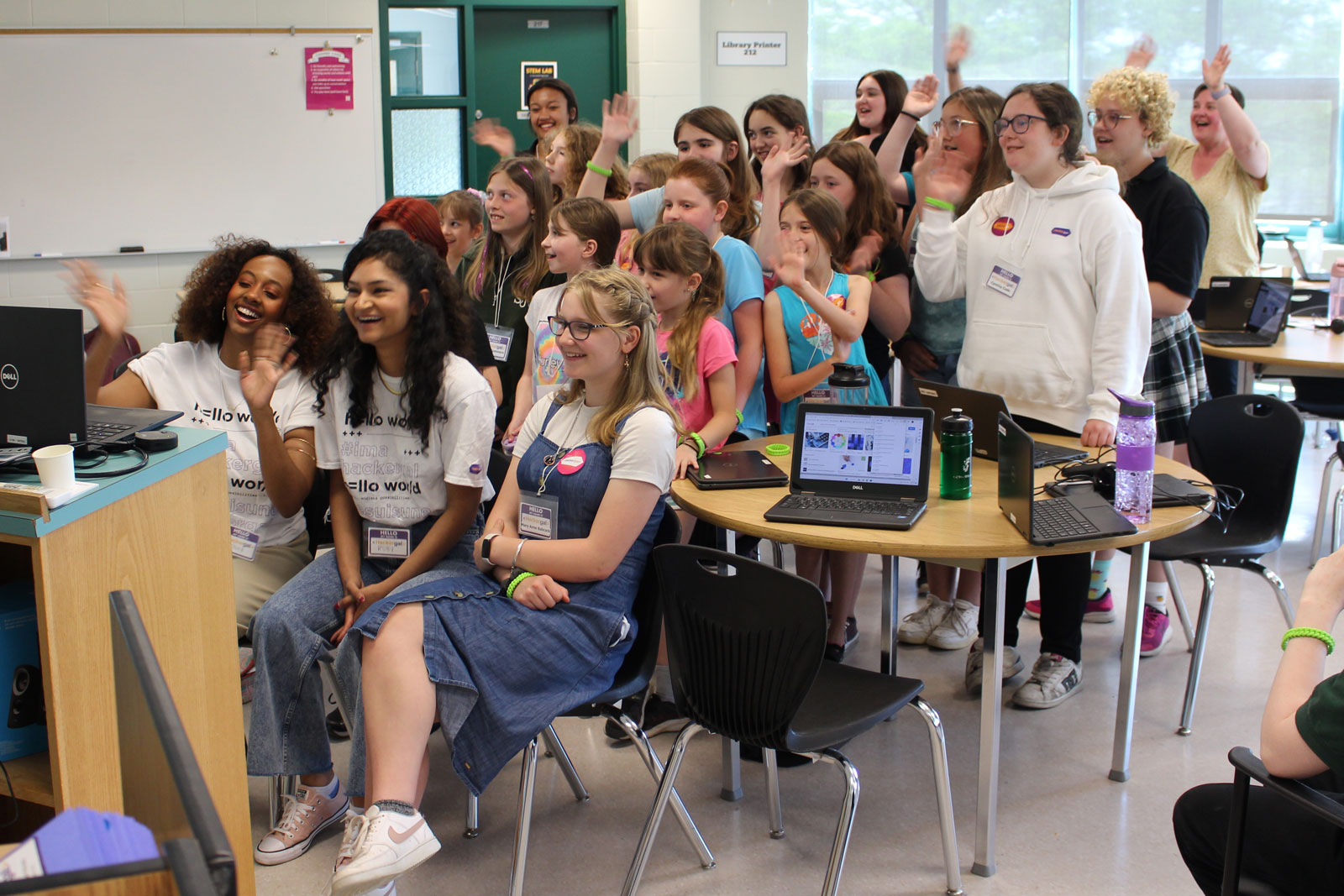 Students saying hello and taking part in the live stream event.